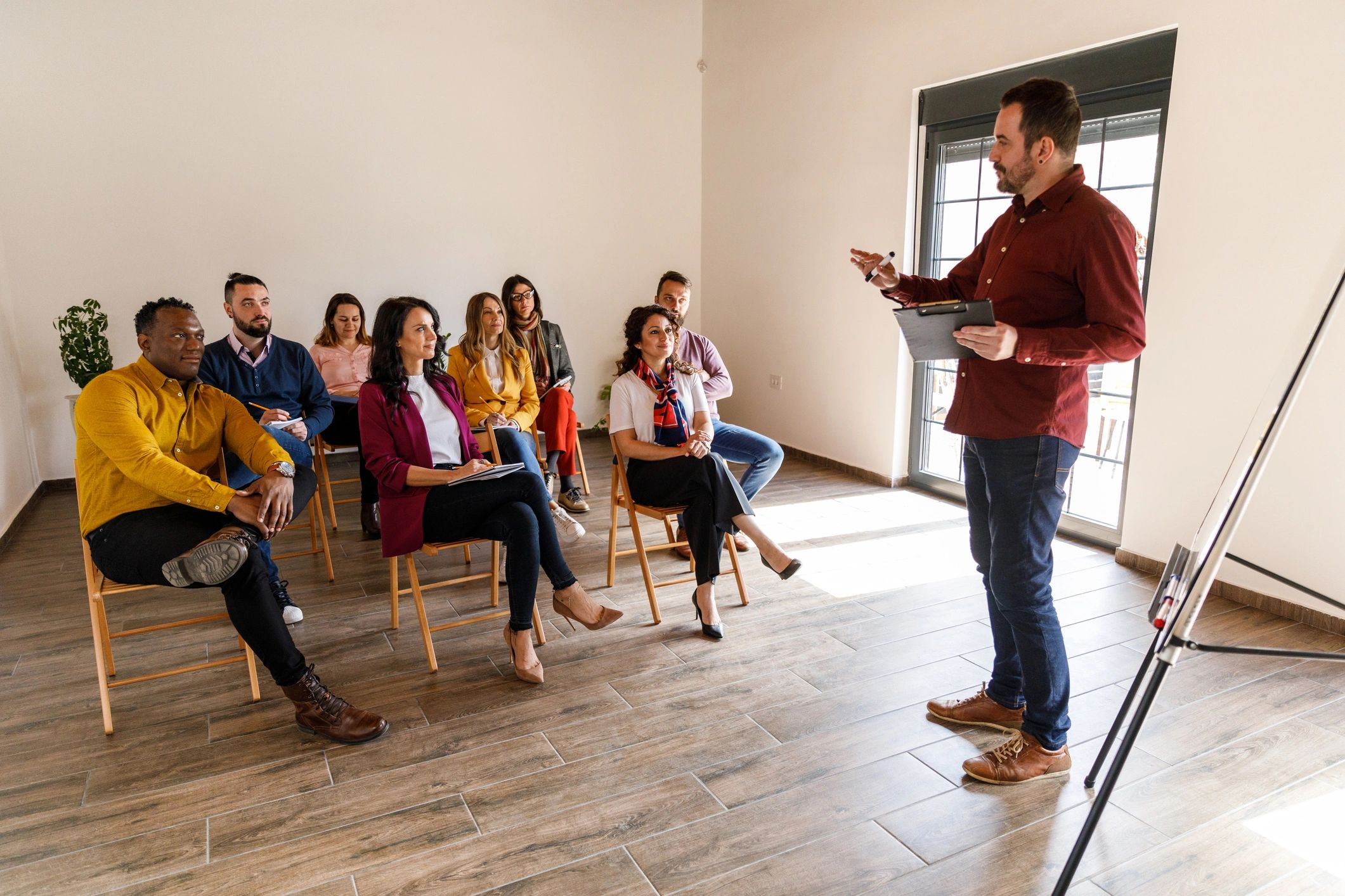 Coach presenting a training session to a real estate team