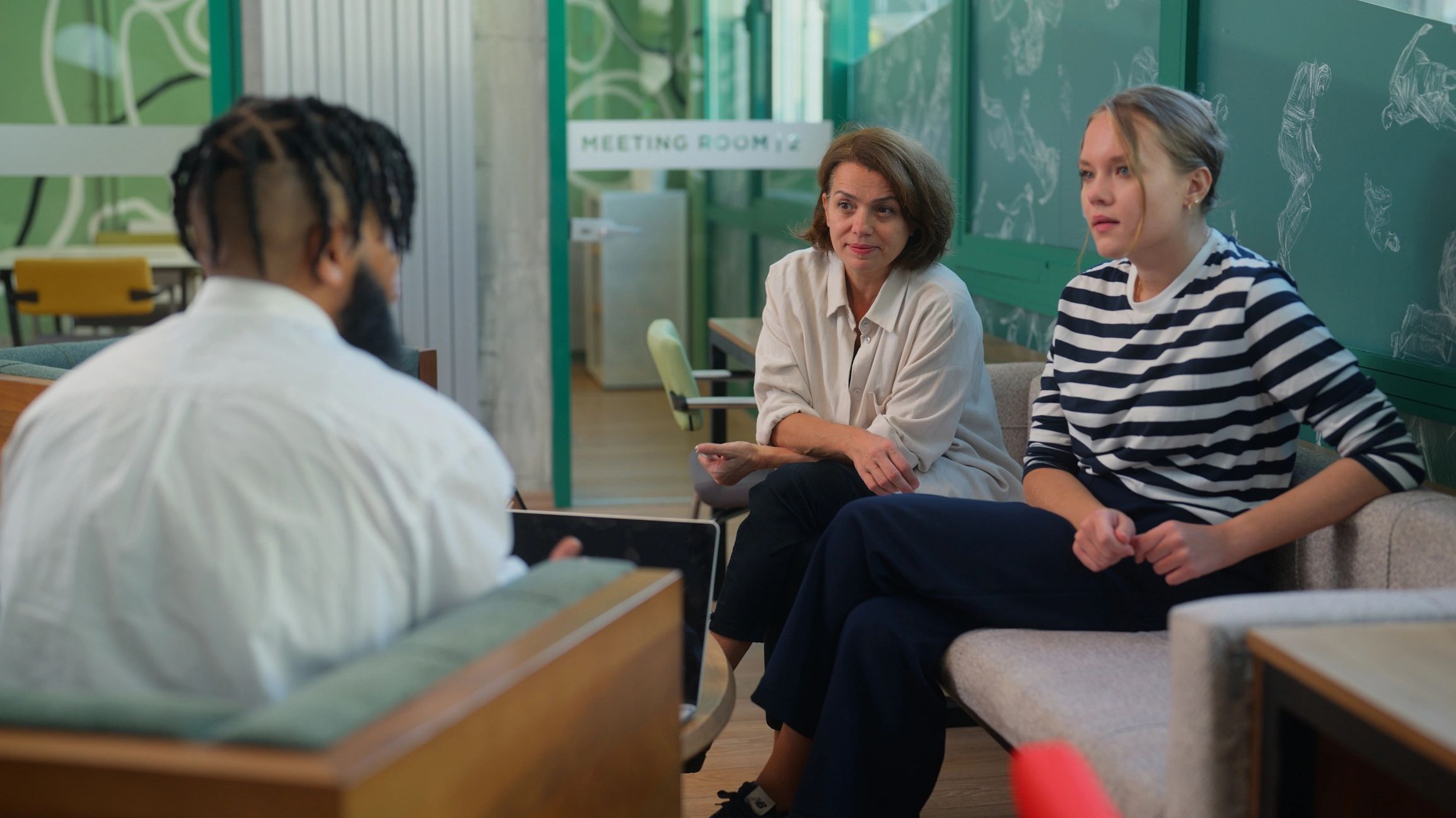 Real estate professionals collaborating in a modern office